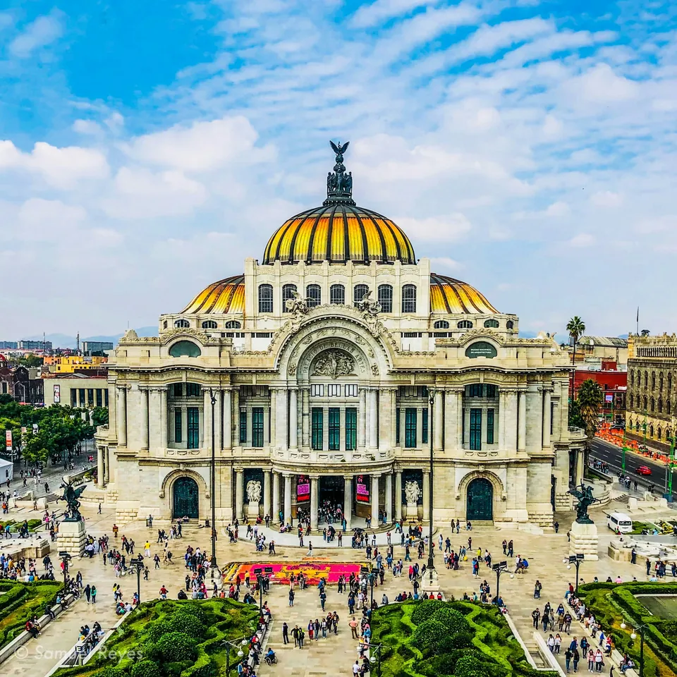 Palacio de Bellas Artes under a blue sky in downtown Mexico City